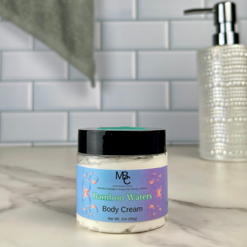 Jar of Bamboo Waters Body Cream on a marble surface with a tiled wall background