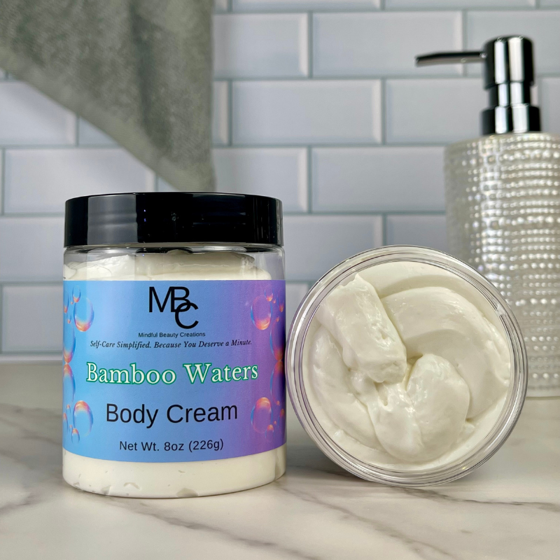 Jar of Bamboo Waters Body Cream with a visible brand label on a bathroom counter.