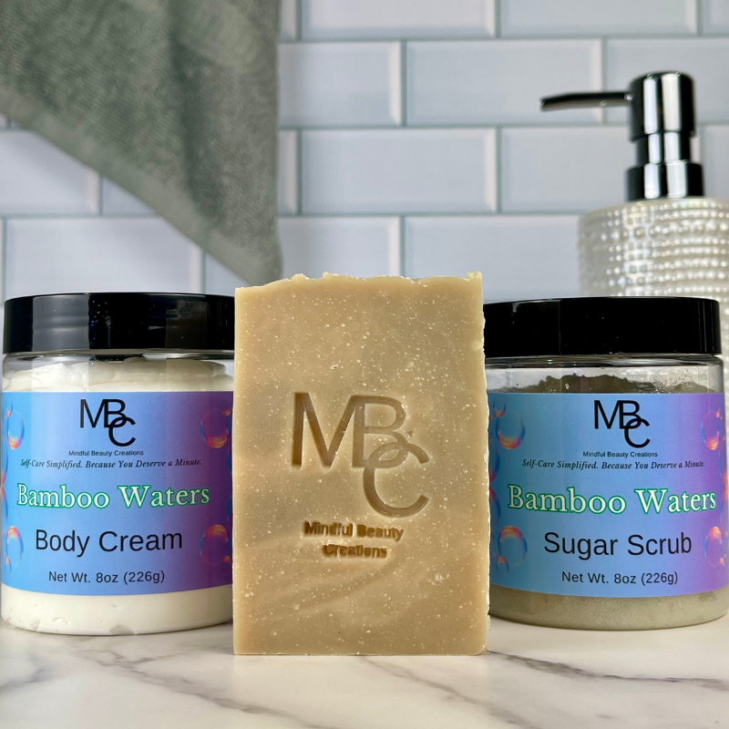 MBC skincare products including body cream, soap, and sugar scrub on a marble surface with a tiled wall background.