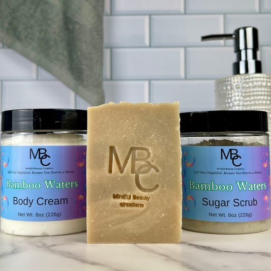 MBC skincare products including body cream, soap, and sugar scrub on a marble surface with a tiled wall background.
