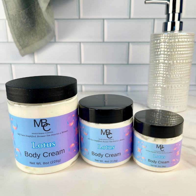 Three jars of Lotus Body Cream on a bathroom counter with a tiled wall background.