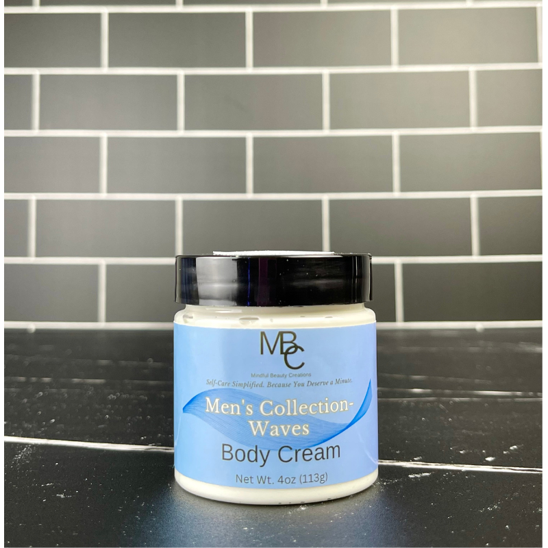 Jar of Men's Collection Waves Body Cream on a black surface with a tiled wall background